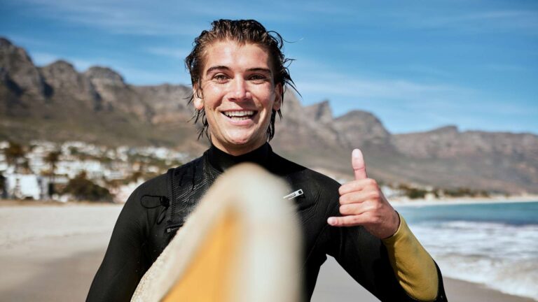 Cheery surfer enjoying the waves at Camps Bay, THREE43 on B
