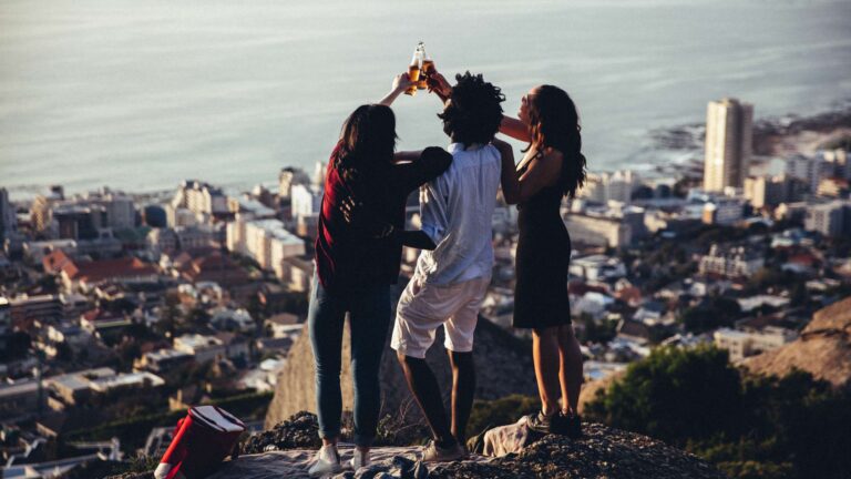 Friends sharing a drink on Signal Hill Cape Town , THREE43 on B